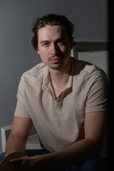 Capturing a moment of quiet reflection in soft light during an indoor session with a thoughtful...