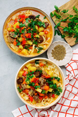 Traditional Uzbek dish lagman made from vegetables, meat and noodles .