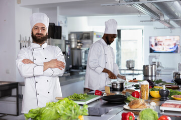 Culinary artists in the kitchen preparing gourmet dishes with fresh ingredients, doing food prep and cooking with stainless steel tools or utensils. Professionalism and attention to detail.