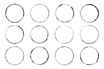 Obraz premium Set of grunge circle stamps. Abstract textured ink shapes, distressed dotted circles, vintage hand drawn frames. Vector round line elements with smudged edges.