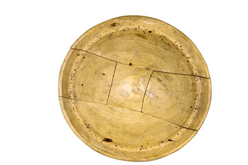 Antique millinery form for shaping pork pie hats. Vintage wooden block used in hat making. Craftsmanship, old professions, artisan work concept. Isolated on white background. Copy space