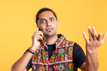 Portrait of dumbstruck man confused about friend over stupid arguments in debacle, studio...