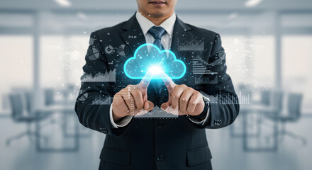 Businessman finger pressing glowing cloud icon, surrounded by floating data graphs and analytics
