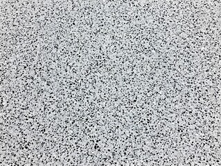 Grey speckled texture background, small stone, aggregate, pebble, surface