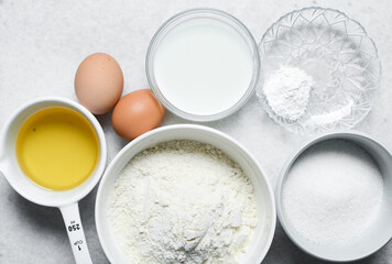 Overhead view of ingredients for making homemade cake, top view of mise en place of ingredients for making cake