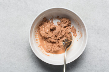 Overhead view of nigerian akamu or pap paste, process of making akamu, flatlay of process of making nigerian akamu ogi pap or guinea corn pudding