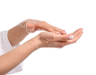 Woman applying body scrub onto her hands on white background, closeup