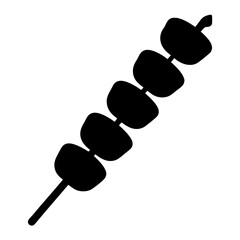 Silhouette of a Delicious Food Skewer with Seven Round Pieces of Meat or Fruit