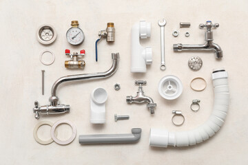 Set of plumber's items on white grunge background