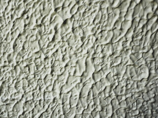 Wall texture with grooves and cracks.