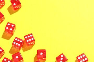 Red game dices on yellow background