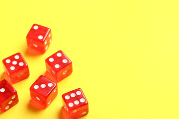 Red dices on yellow background