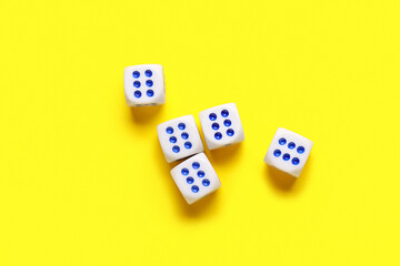 Dices with red and blue pips on yellow background