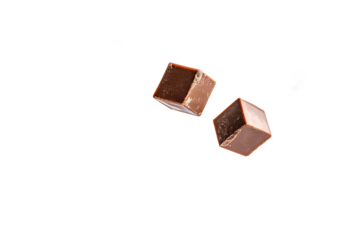 Two chocolate cubes floating in dark space offering a sweet treat for those with a sweet tooth craving