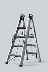 Metal stepladder on light background