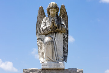 Fototapeta premium Beautiful angel tombstone topper sculpture
