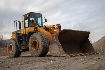 Yellow Backhoe on Construction Site