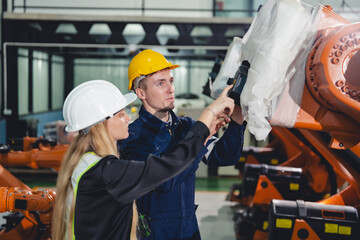 Technician Engineer in Factory, Maintaining and Repairing Robotic Arms Machinery, Ensuring Smooth Operation Automation in Manufacturing Process, Advanced Technology for Efficient Production innovation
