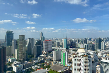 Fototapeta premium Aerial view of skyline Bangkok city, Thailand with blue sky