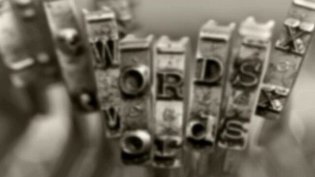 The word WORDS with old typewriter hammers, zooms in 
