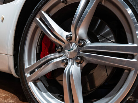 Aston Martin Vantage chrome wheel and red brake caliper, Luxury sports car rim