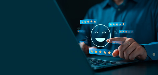 Customers use laptops to rate 5 stars with happy smiles through online applications, customer...