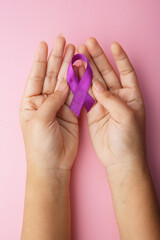 Palm Hands Holds Purple Ribbon On Pink Background. Support Epilepsy, Dementia And Mental Health.