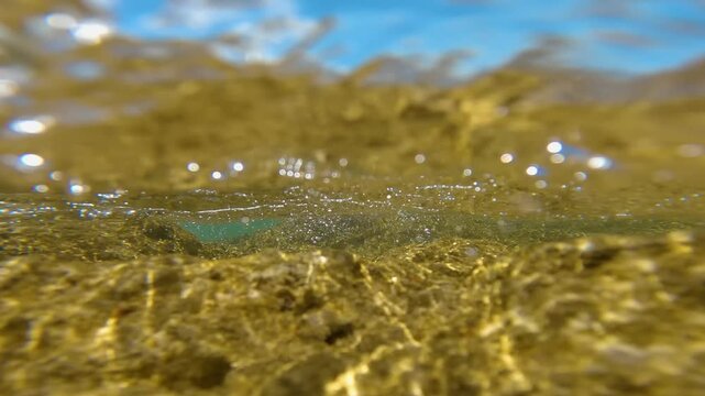 This footage provides a unique perspective from inside Assyk Kul Lake in Kyrgyzstan, capturing the beauty of the water and its surroundings.