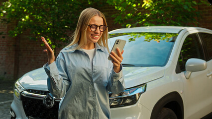 Caucasian woman businesswoman using mobile phone smartphone message notification good news enjoy...