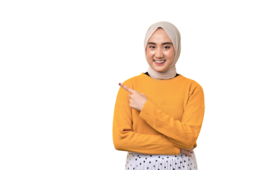 Beautiful cheerful Asian girl wearing hijab pointing finger at empty copy space isolated on transparent background