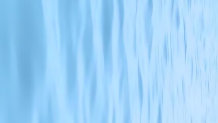 Obraz premium Abstract Water Surface Texture: Light Blue, Smooth Waves, Background Image