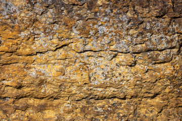 Macro abstract texture background of the grinding surface on a 19th century grist mill stone