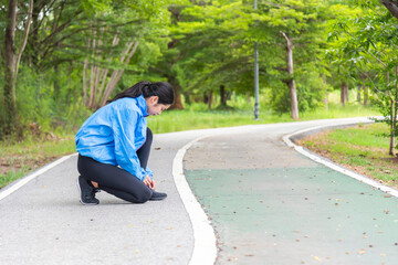 Beautiful Sport woman in sportswear running in the park. Healthy lifestyle and sport concept