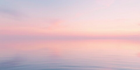 Obraz premium Serene Pink Sunset over Calm Ocean Water