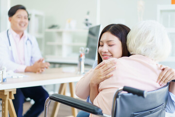 Fototapeta premium Elder woman and daughter have a consulting with doctor.