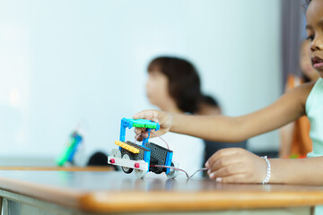 Group of diverse children enjoy learning about the STEM.