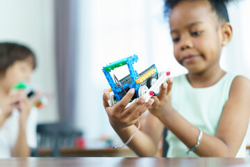 Group of diverse children enjoy learning about the STEM.