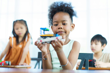 Group of diverse children enjoy learning about the STEM.