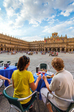 Tourst couple at a tapas bar, plaza Mayor, Salamanca, Spain
