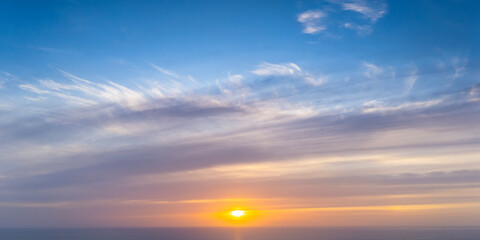 Beautiful sunset cloudscape over the ocean horizon