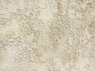 Light beige textured paint or light cream textured paint washed on a wall or panel, seamless background texture. Suitable for bump, bark, or graphic background. No people.