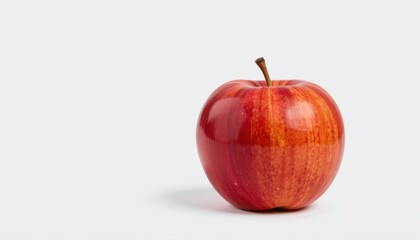 This isolated apple exudes a tempting aroma, reminiscent of a crisp and juicy bite. The white background enhances the apple's vivid colors, making it stand out against the blank canvas