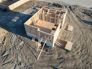 House is being built in a field
