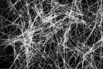 Obraz premium Abstract intricate network of white lines against black background. Intricate web-like structure