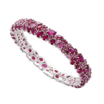 luxurious ruby armlet adorned with cascading round rubies, showcasing elegance and sophistication