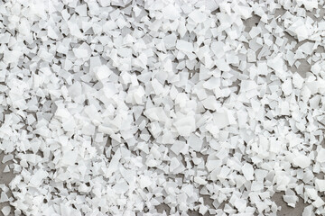 Close-Up of Magnesium Salt Flakes on grey concrete background, detailed white particles sea salt, natural pattern Magnesium therapy, Health Benefits, self-care, promoting wellness, home relaxation