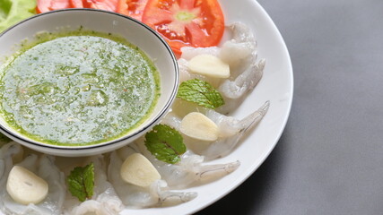 shrimp in fish sauce with Thai spicy seafood dipping sauce on white plate