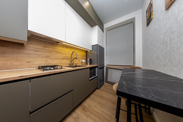 Apartment Kitchen Modern Design: Renovated Flat Interior, Compact Layout, Stylish Appliances.