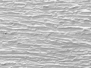 Decorative 3d white textured paint on a wall or panel. White paint with random stroke pattern, rough uneven surfaces. Suitable for bark, bump, paint, or graphic background. Seamless background texture