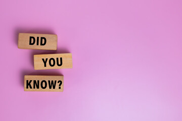 did you know words on wooden blocks isolated on pink background. copy space